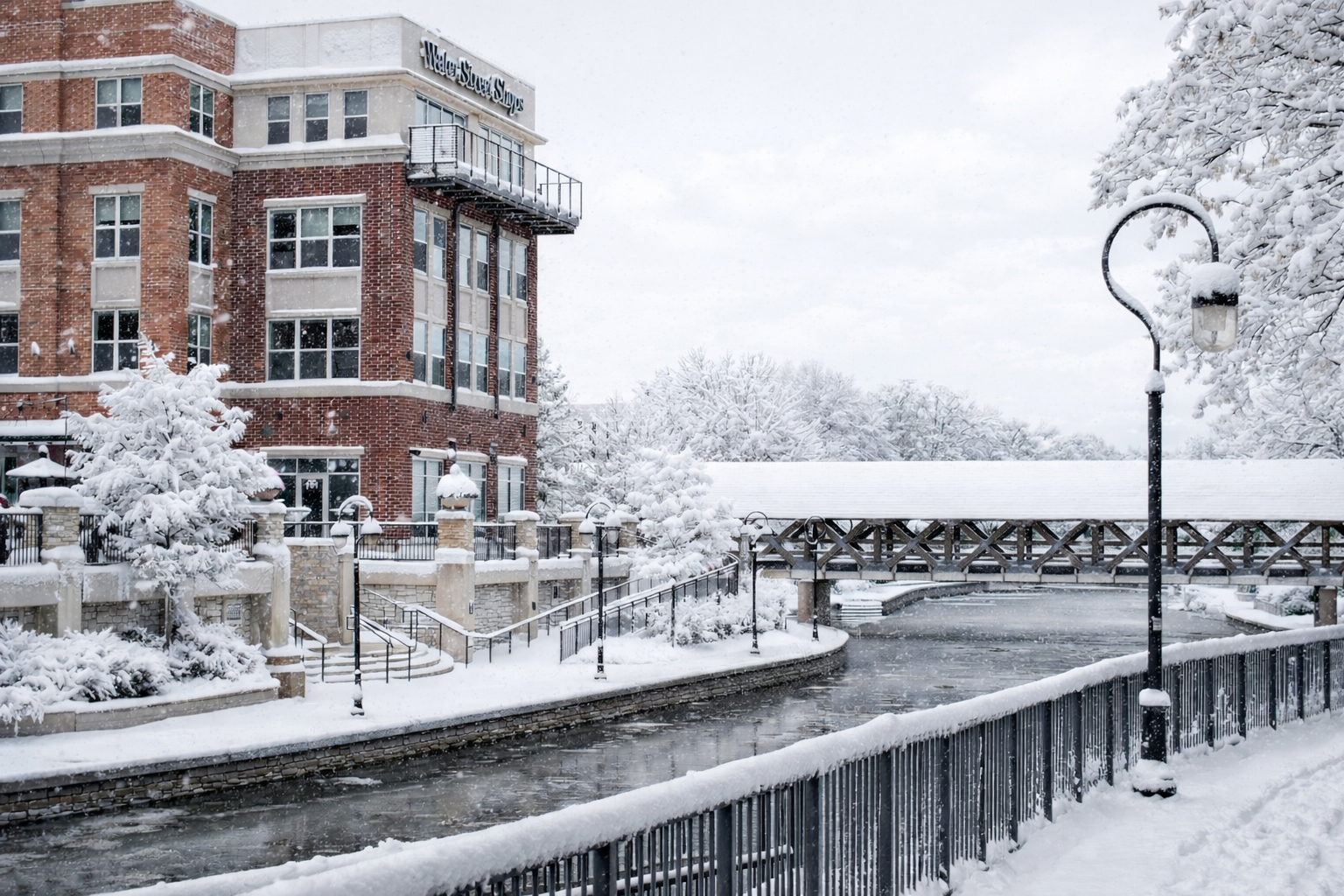 Snow-covered riverside buildings and walkway in the Chicago suburbs